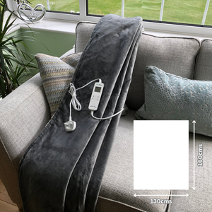 Grey sherpa blanket heated throw on sofa showing 160x130cms size