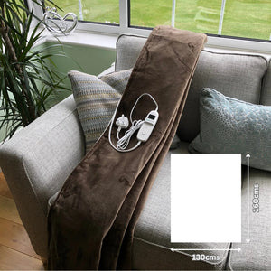  Brown sherpa heated throw on sofa showing the size of 160x130cms