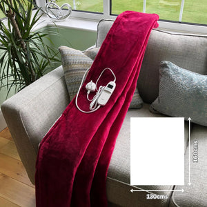 Beautiful raspberry red sherpa heated throw on sofa showing 160x130cms size