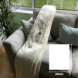 Cream electric sherpa heated throw on sofa showing 160x130cms size