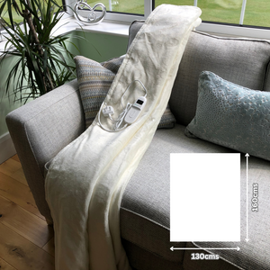 Cream sherpa heated throw on sofa showing 160x130cms size